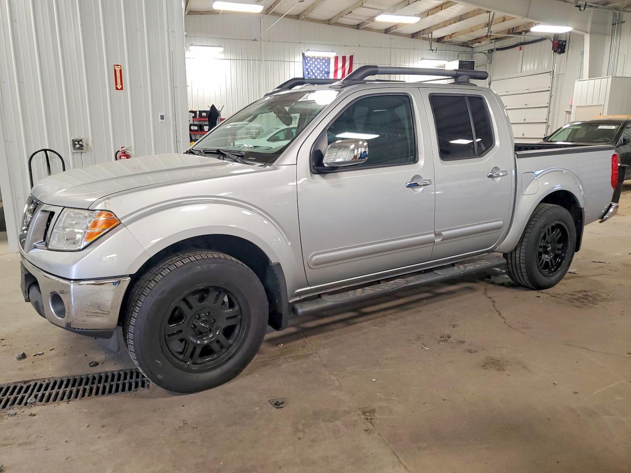 2011 Nissan Frontier SV, VIN 1N6AD0EV9BC443033 — Side