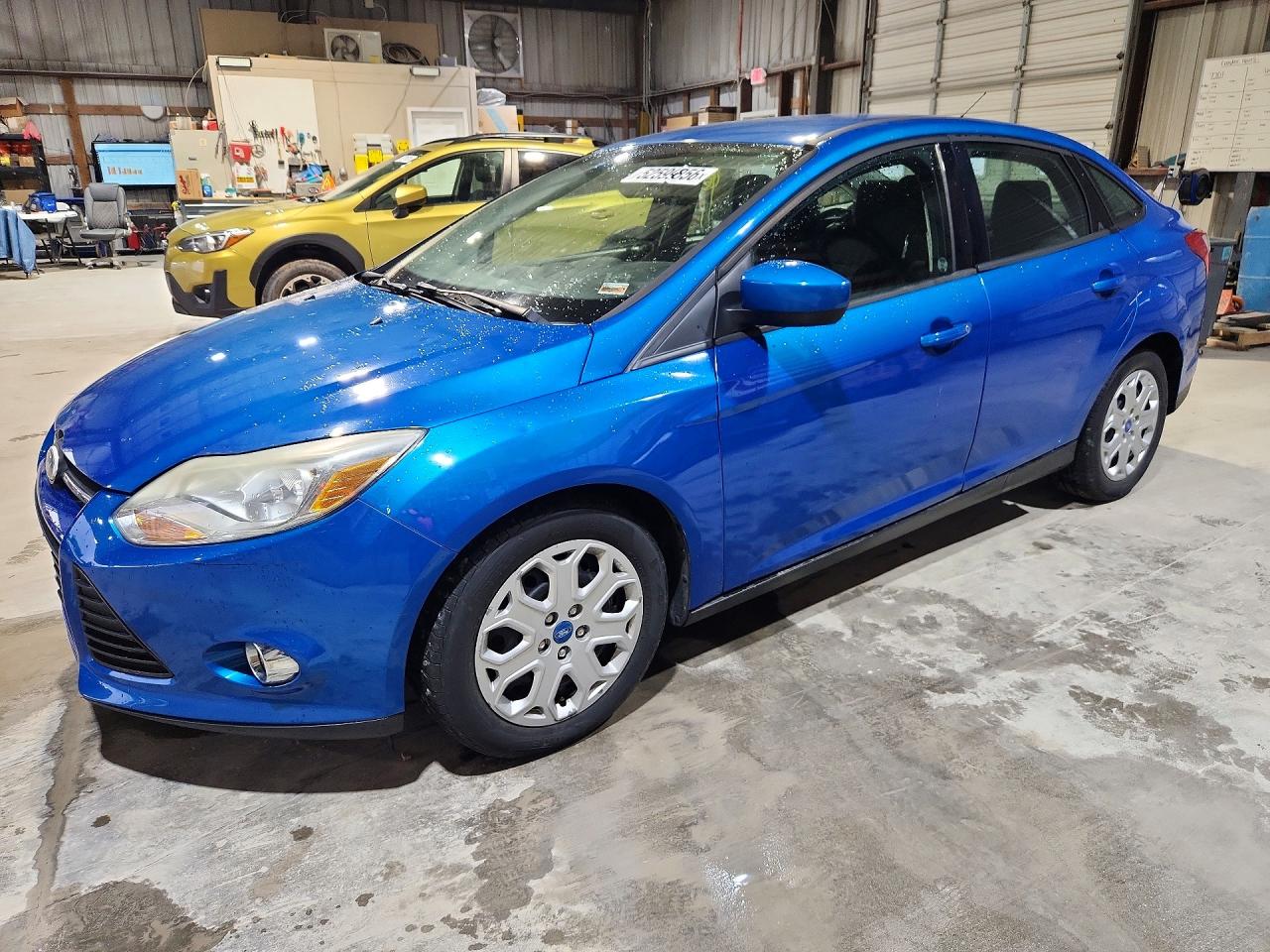2012 Ford Focus SE, VIN 1FAHP3F25CL119812 — Hail