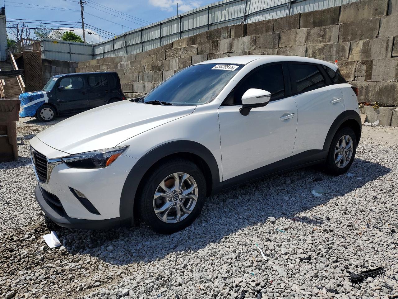 2020 Mazda CX-3 Sport, VIN JM1DKFB70L1470651 — Бок