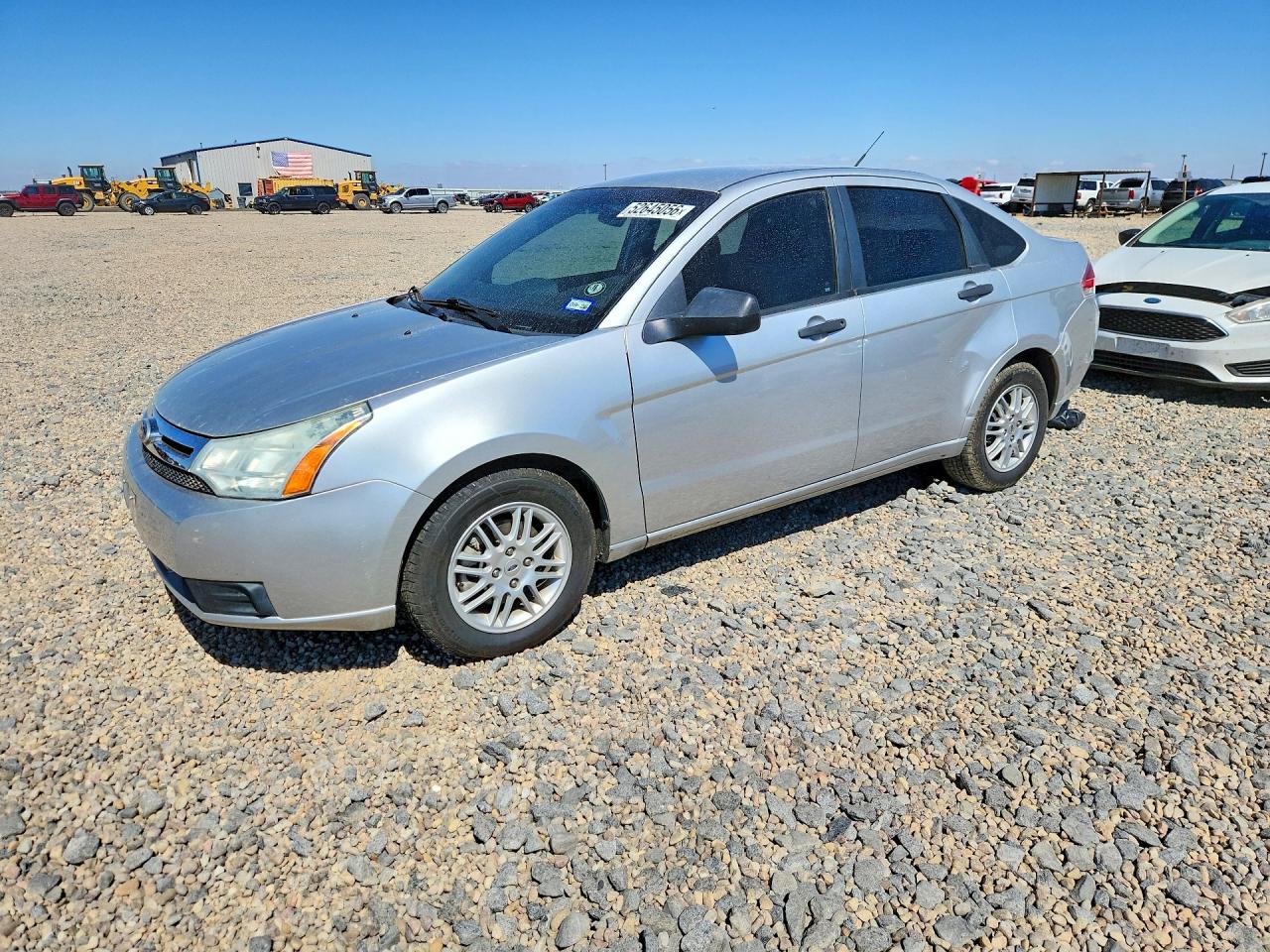 2010 Ford Focus SE, VIN 1FAHP3FN9AW290777 — Side
