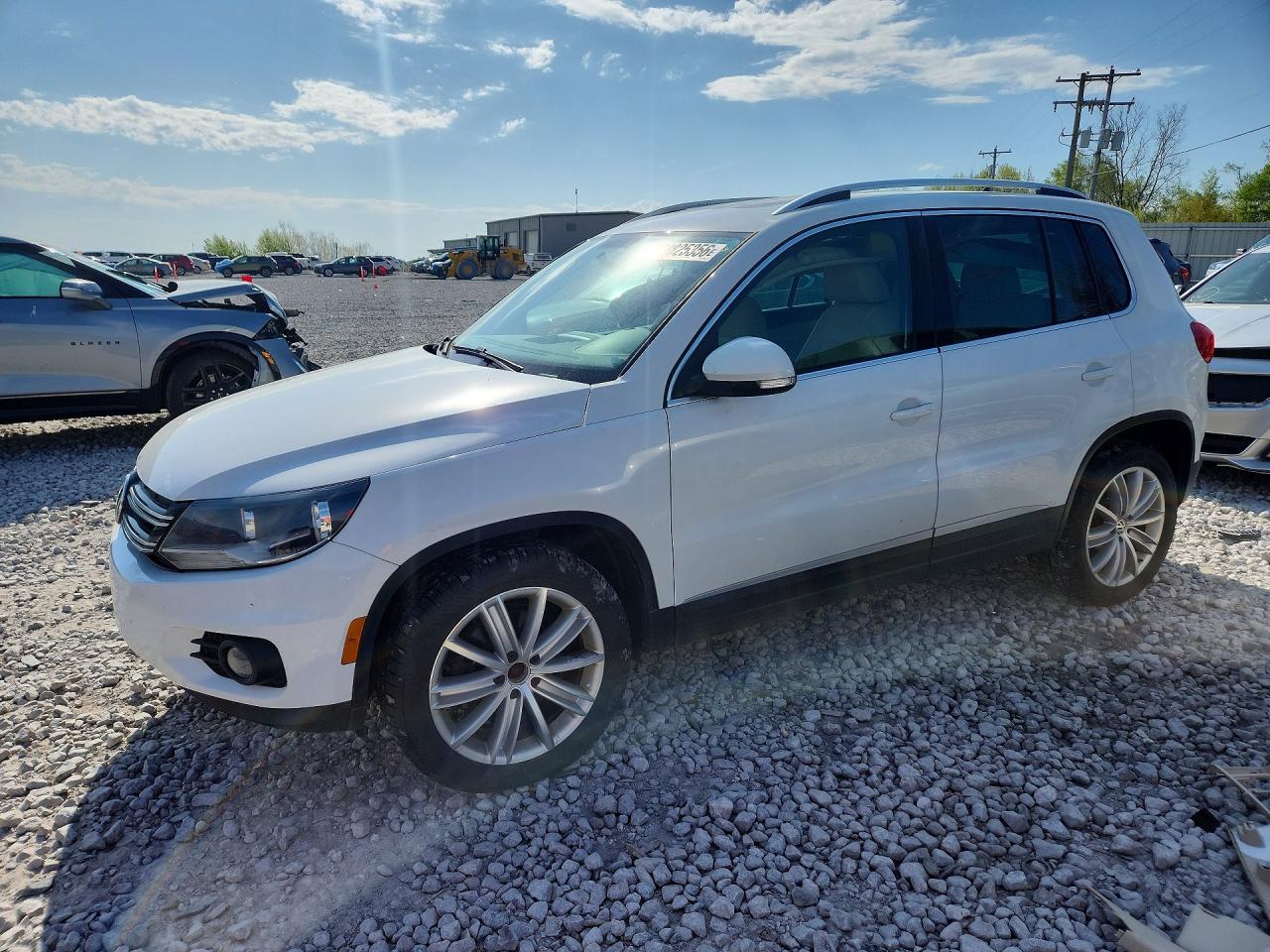 2014 Volkswagen Tiguan S, VIN WVGAV3AXXEW562992 — Partial repair