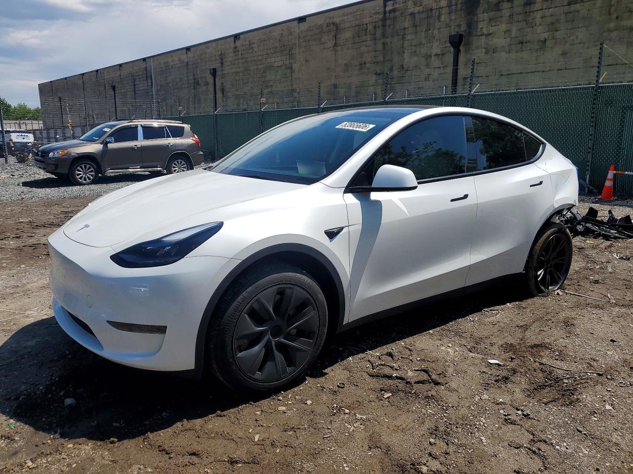 2024 Tesla Model Y, VIN 7SAYGDED7RF128447 — Rear end