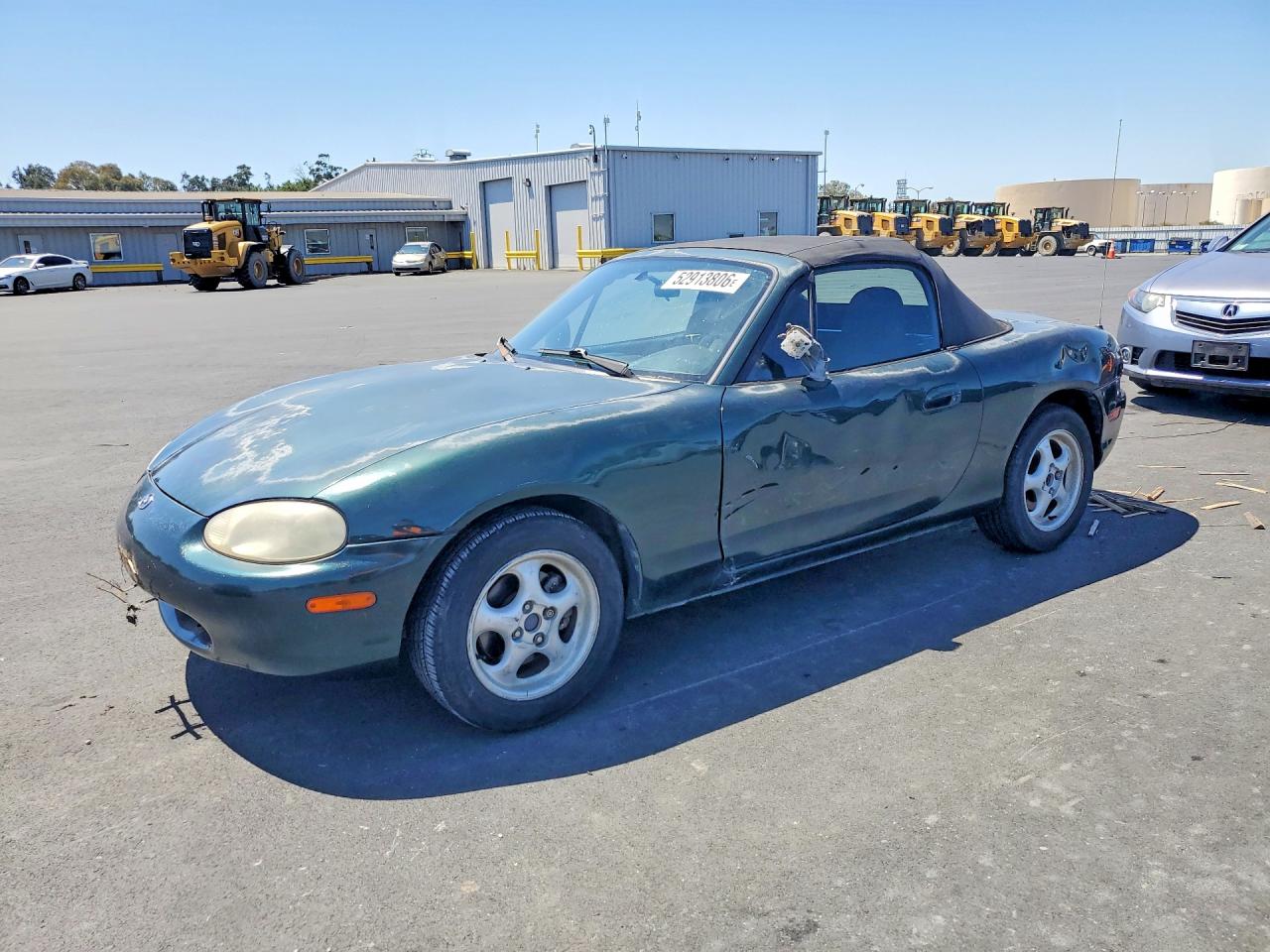 1999 Mazda MX-5 Miata, VIN JM1NB3534X0137862 — Side