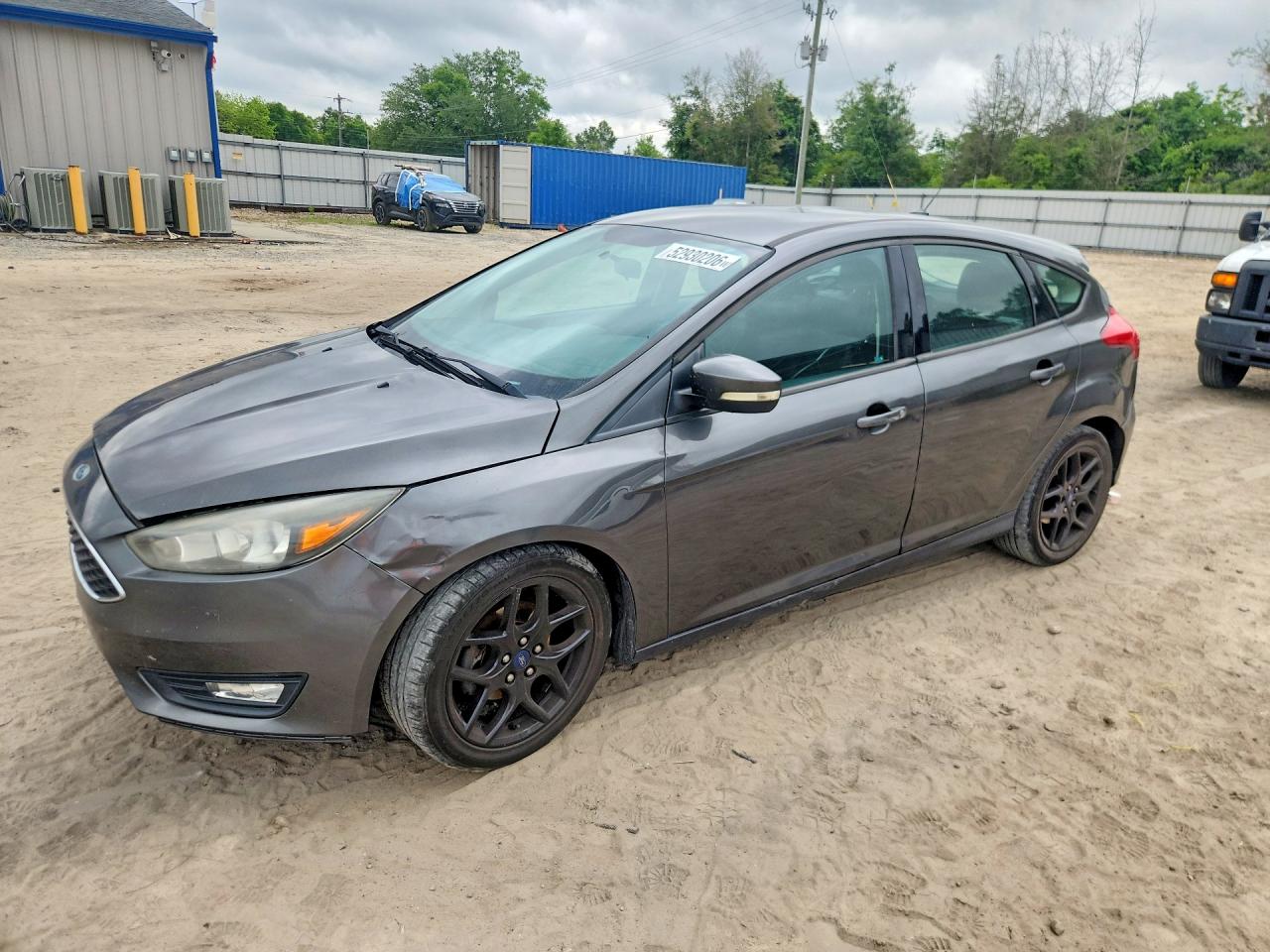 2016 Ford Focus SE, VIN 1FADP3K29GL299564 — Side