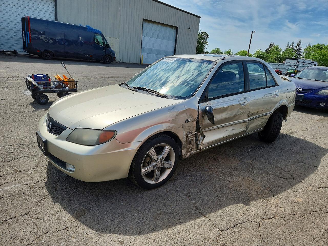 2003 Mazda Protege DX, VIN JM1BJ226131206624 — Side