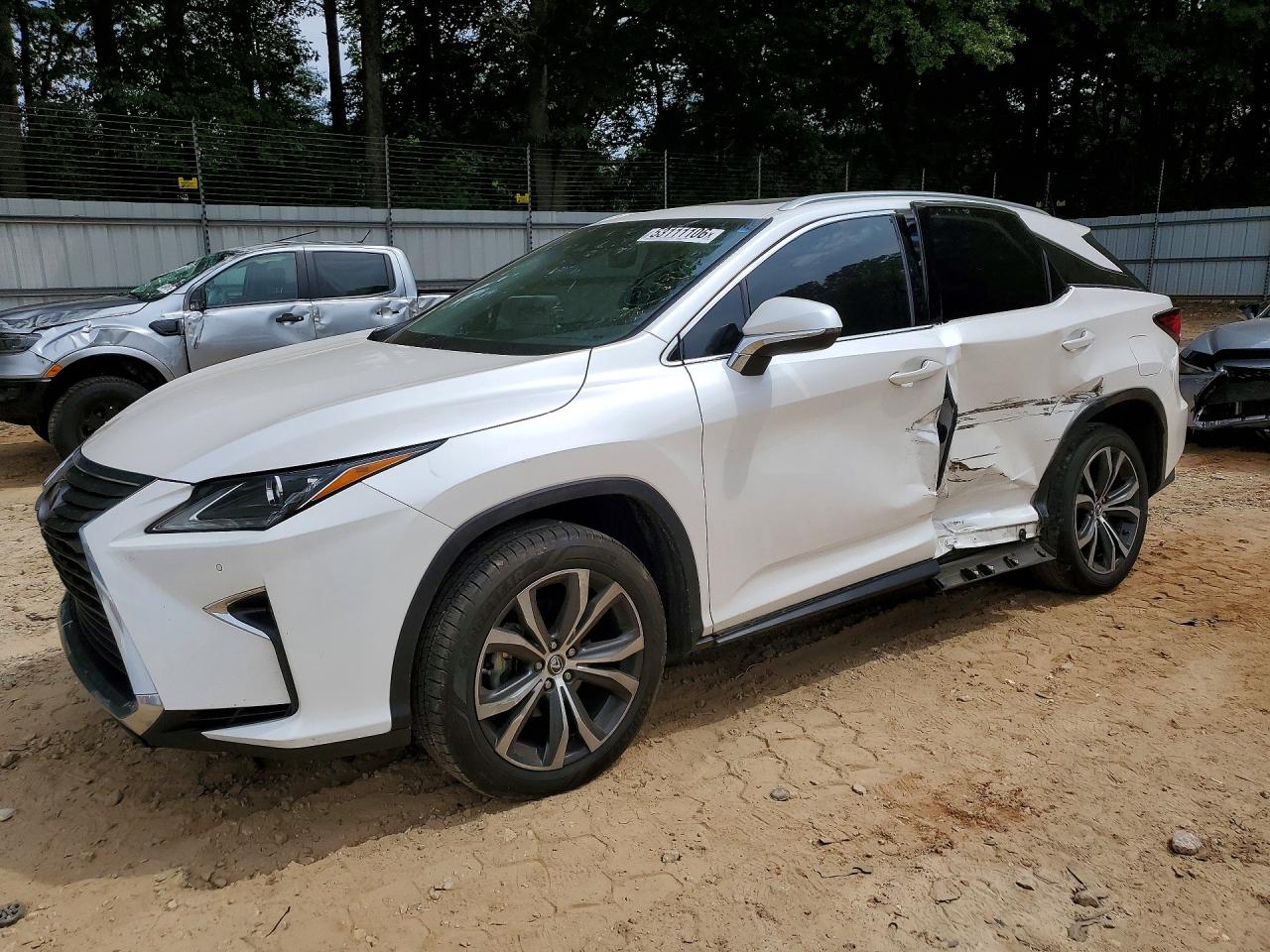 2018 Lexus RX 350, VIN 2T2ZZMCA2JC111094 — Бок