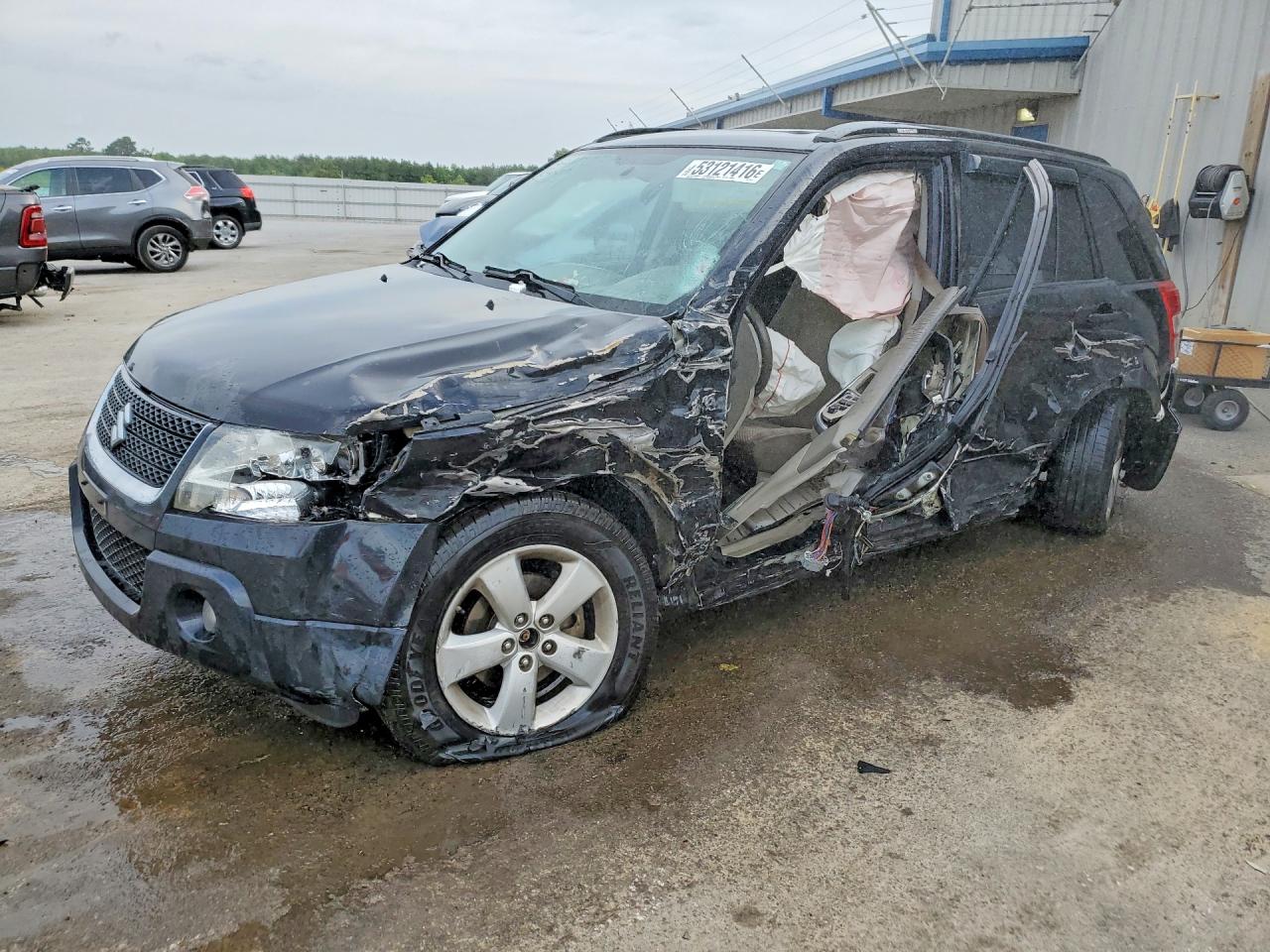 2009 Suzuki Grand Vitara, VIN JS3TE148094100157 — Бок