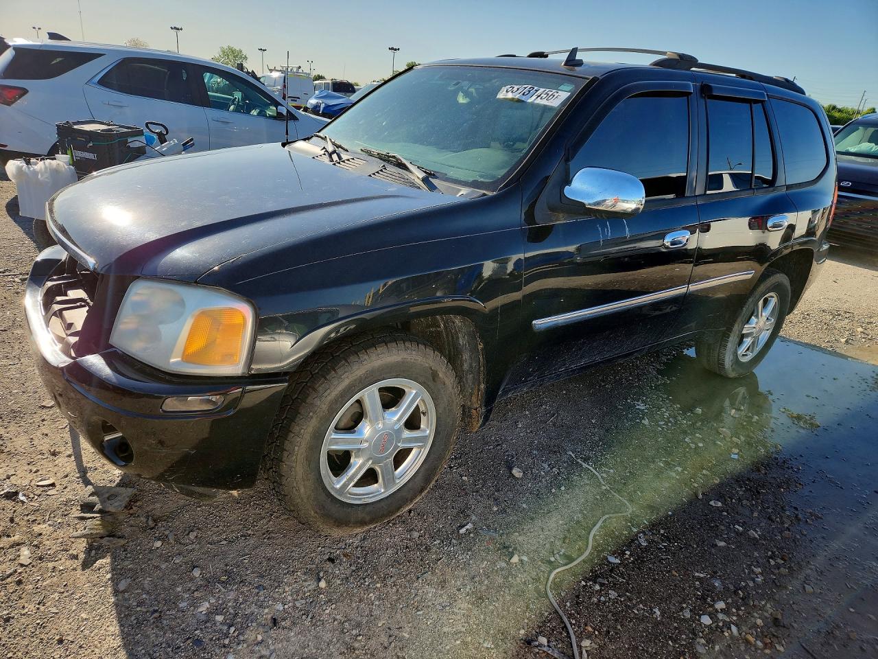 2009 GMC Envoy SLE, VIN 1GKDS33S092114225 — Front end