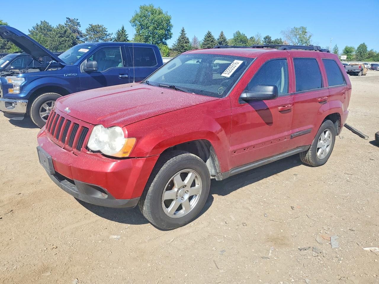 2009 Jeep Grand Cherokee Rocky Mountain, VIN 1J8GR48K89C546342 — Side