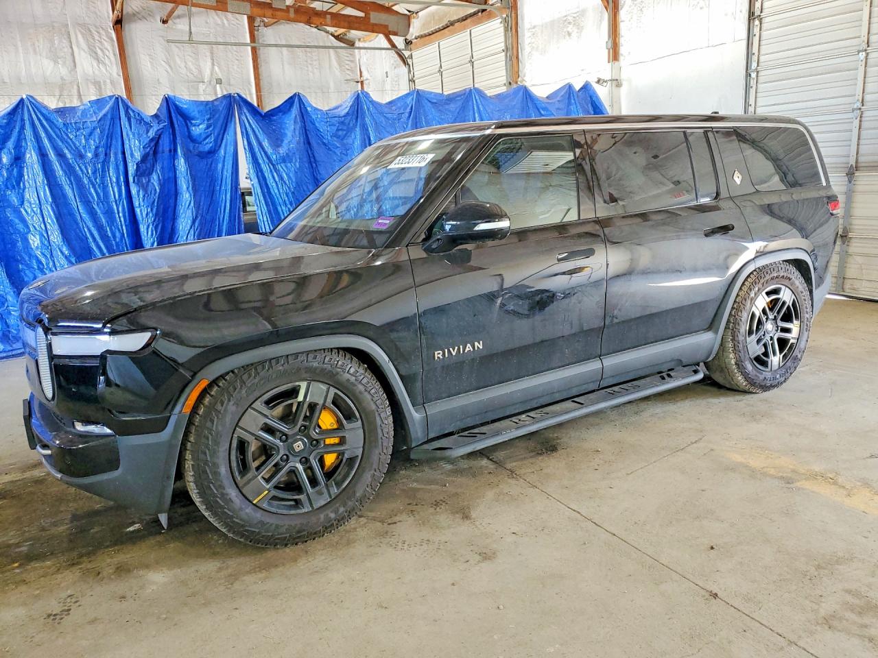 2023 Rivian R1S Adventure, VIN 7PDSGABA3PN012584 — Side