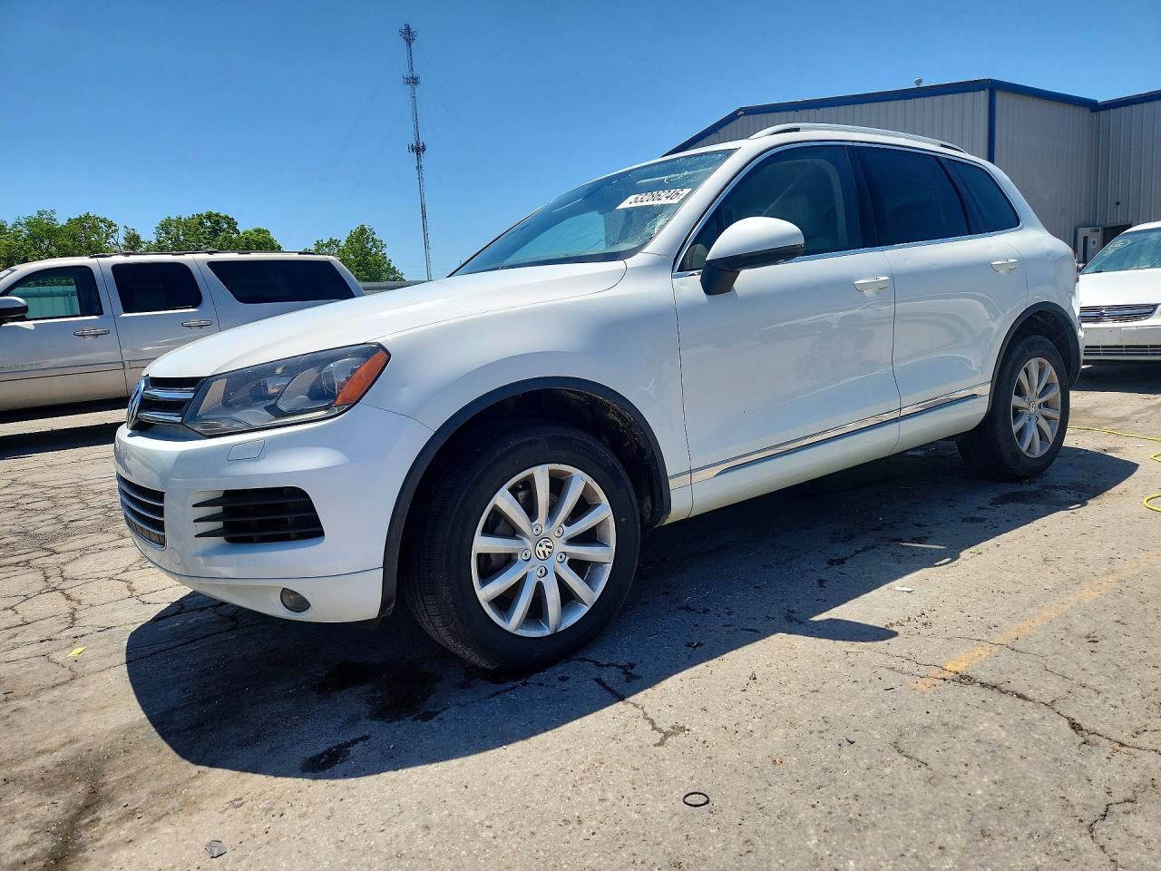 2012 Volkswagen Touareg Sport, VIN WVGEK9BPXCD008033 — Hail
