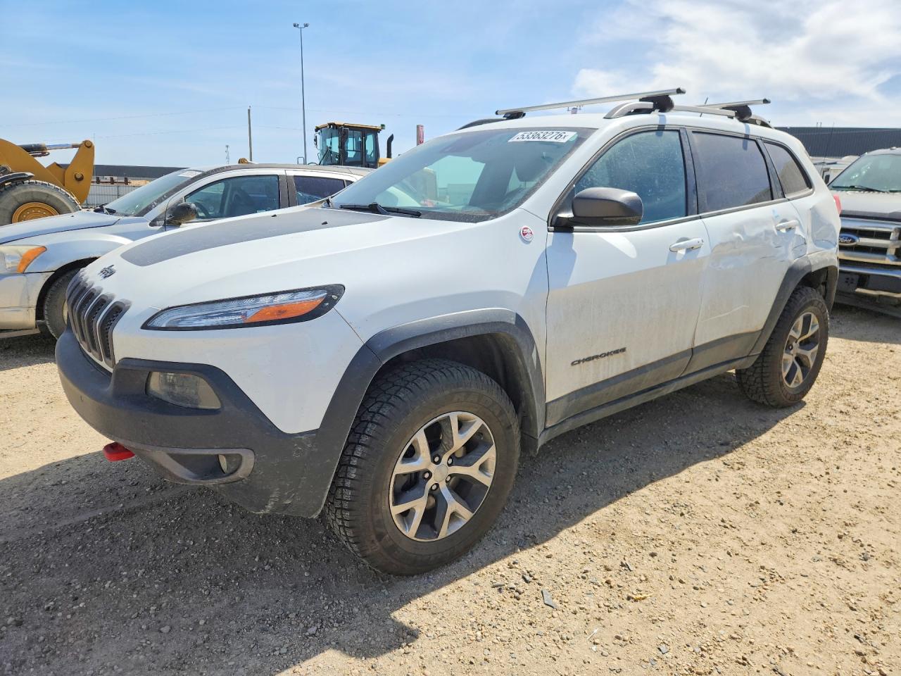 2015 Jeep Cherokee Trailhawk, VIN 1C4PJMBS3FW646849 — Бок
