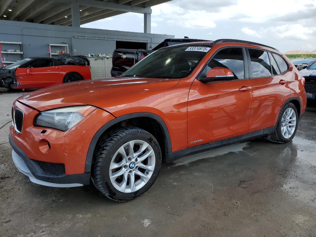 2015 BMW X1 xDrive28i, VIN WBAVL1C51FVY26469 — Side