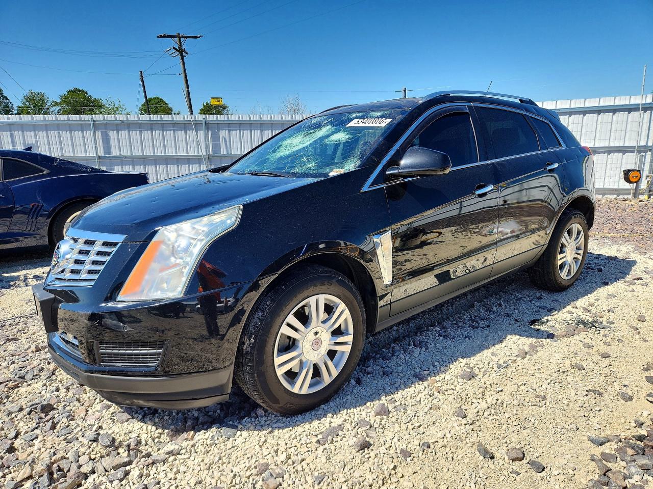 2016 Cadillac SRX Luxury Collection, VIN 3GYFNBE38GS500821 — Hail