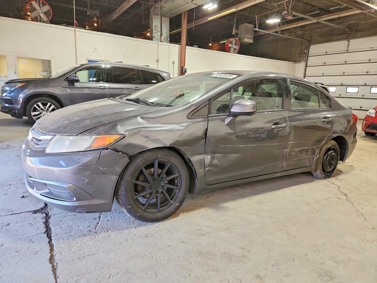2012 Honda Civic EX, VIN 19XFB2F80CE015767 — Prior damage history