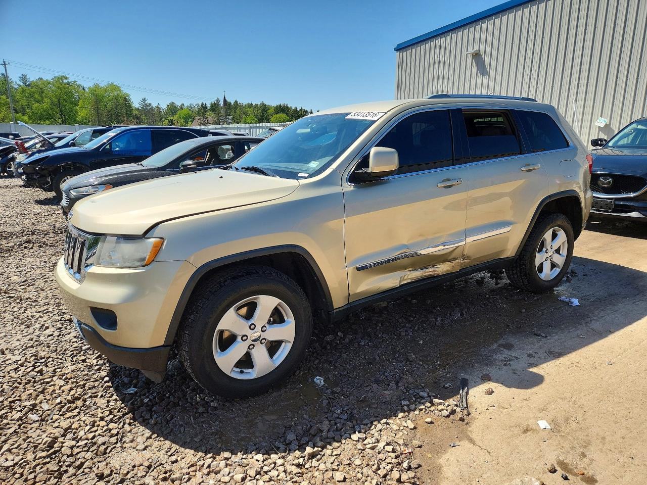 2011 Jeep Grand Cherokee Laredo, VIN 1J4RR4GG8BC598003 — Side