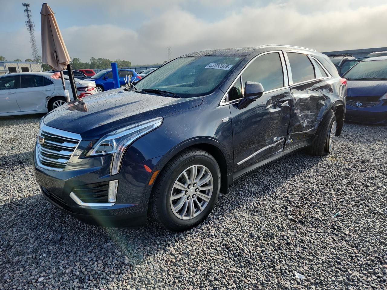 2018 Cadillac XT5 Luxury FWD, VIN 1GYKNCRS9JZ218378 — Side