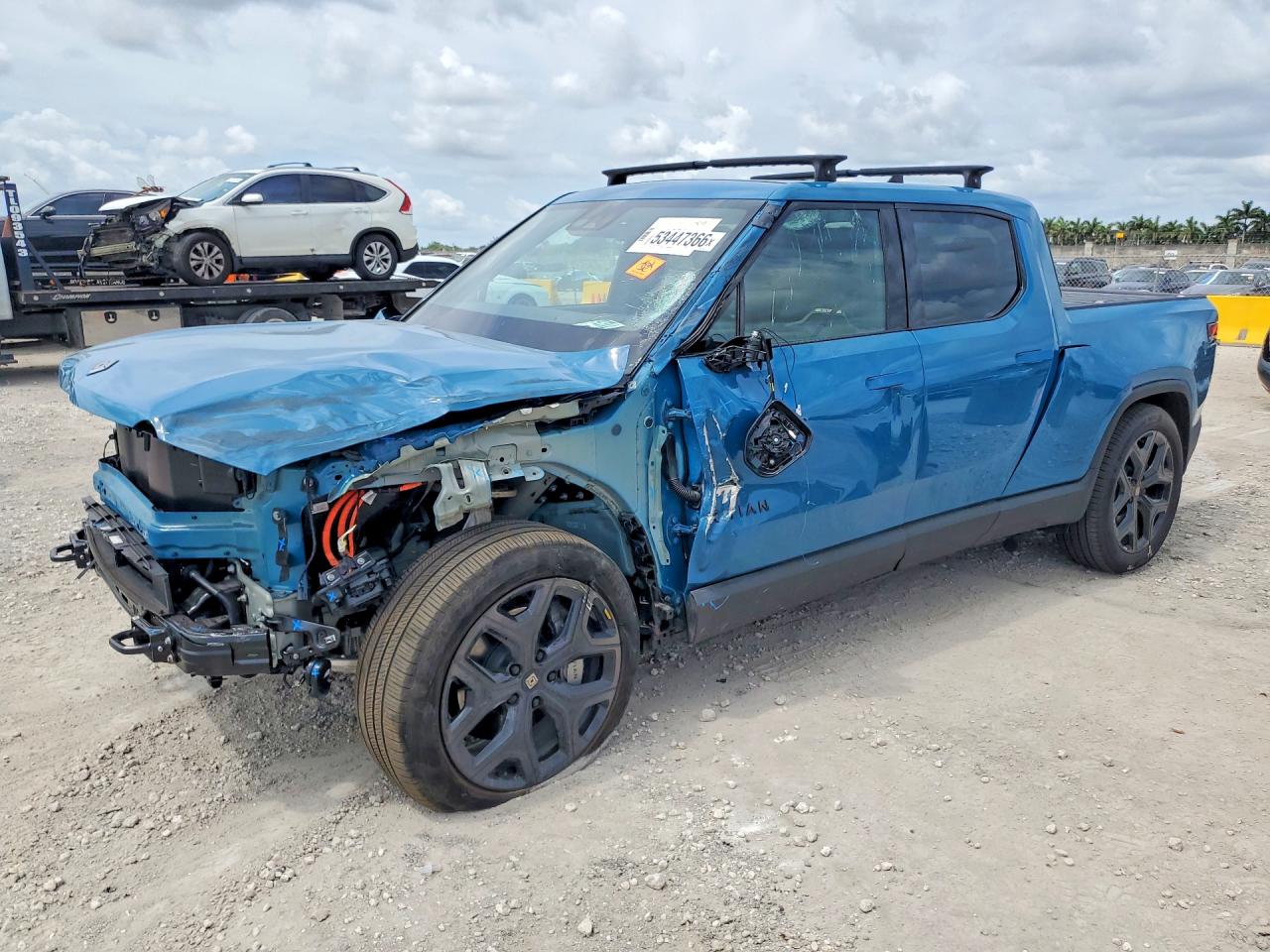 2025 Rivian R1T Adventure, VIN 7FCTGBAA9SN038225 — Front end