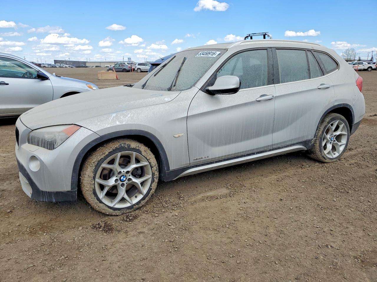 2012 BMW X1 28i, VIN WBAVL1C58CVR76431 — Side