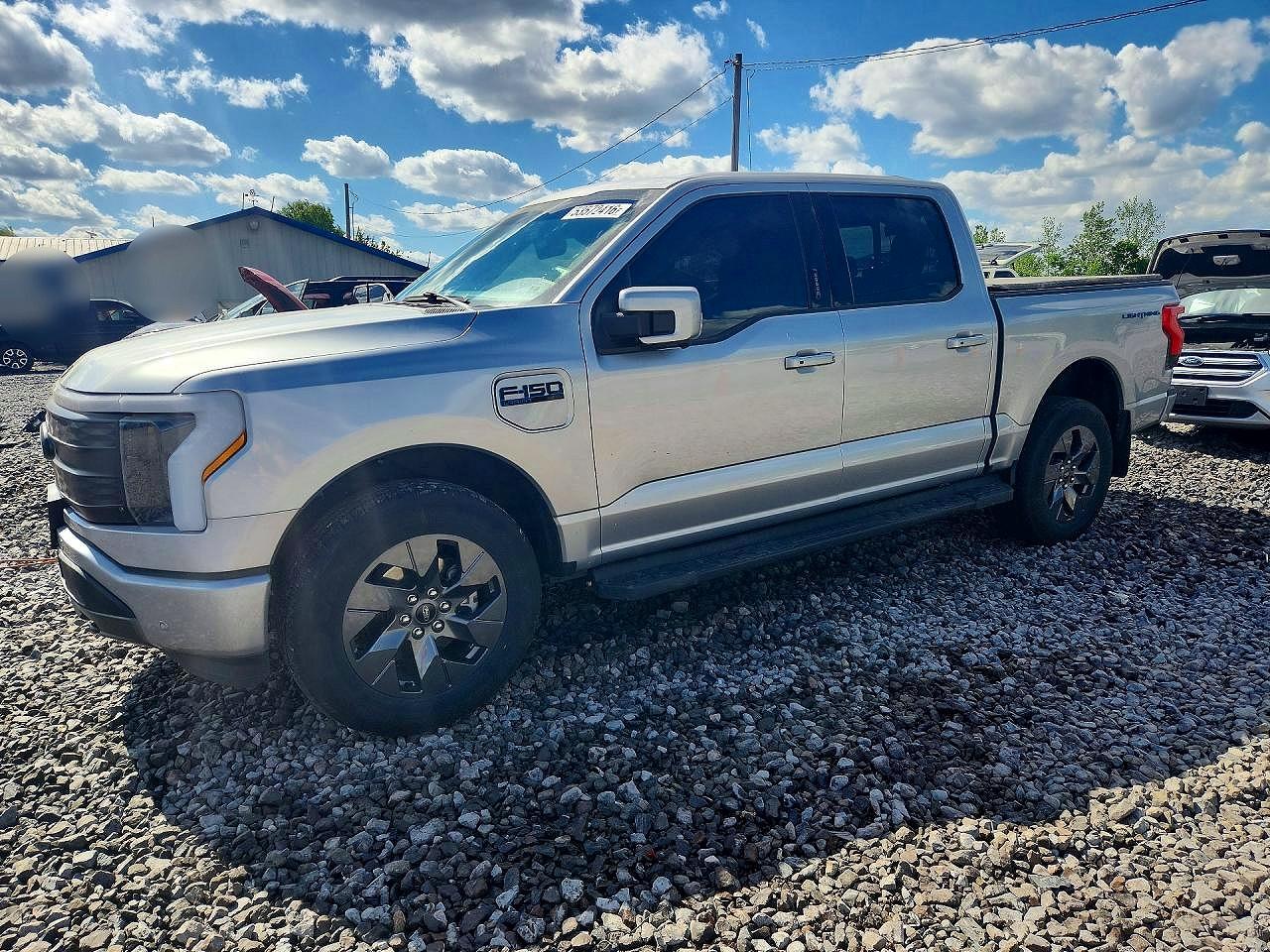 2024 Ford F-150 Lightning Lariat, VIN 1FT6W5L77RWG19719 — Side