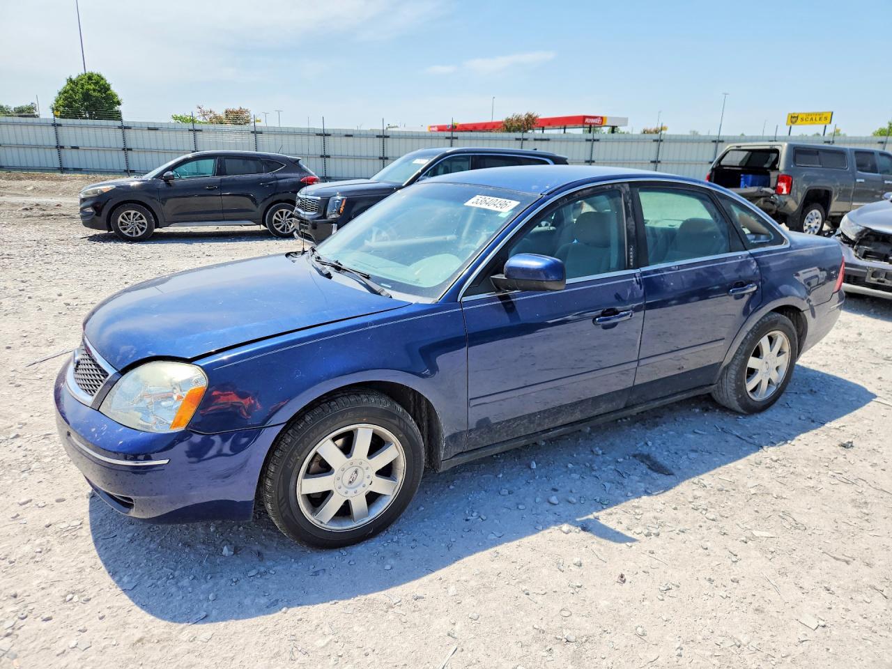 2006 Ford Five Hundred SE, VIN 1FAFP23166G142042 — Side
