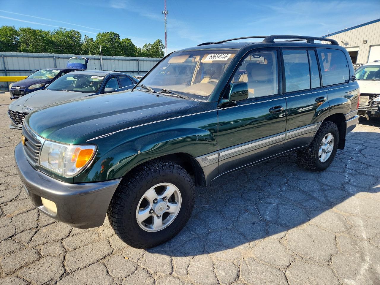 1999 Toyota Land Cruiser, VIN JT3HT05J7X0059976 — Hail