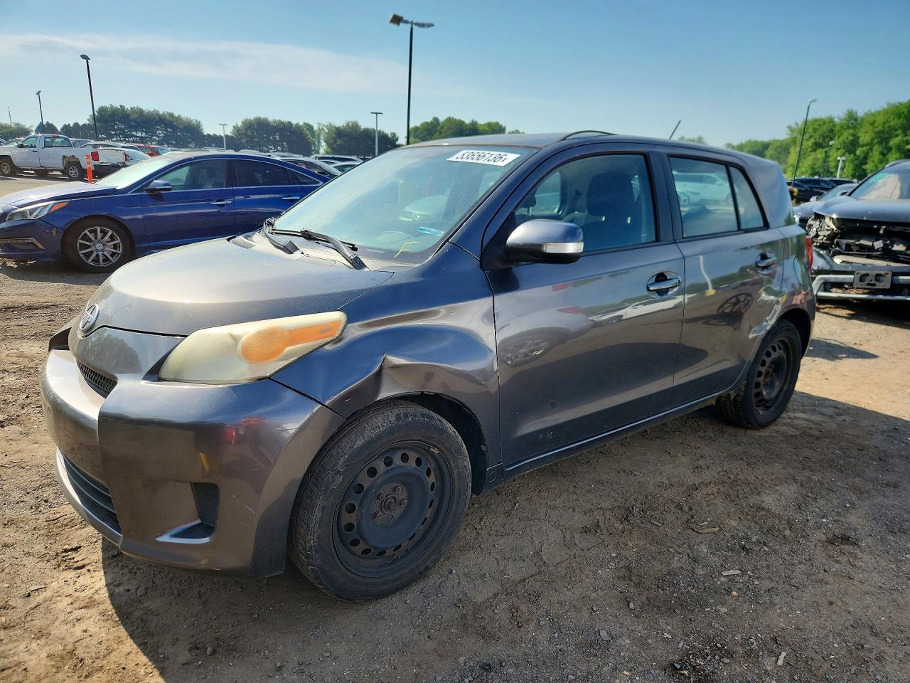 2010 Scion xD, VIN JTKKU4B46AJ054962 — Бок