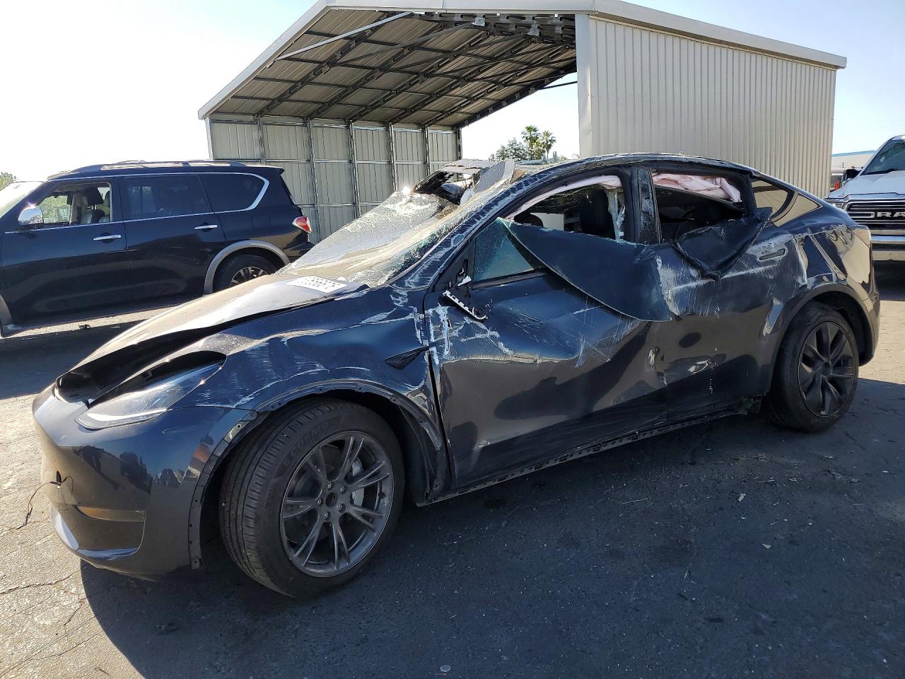 2024 Tesla Model Y, VIN 7SAYGDED3RF103724 — Rollover