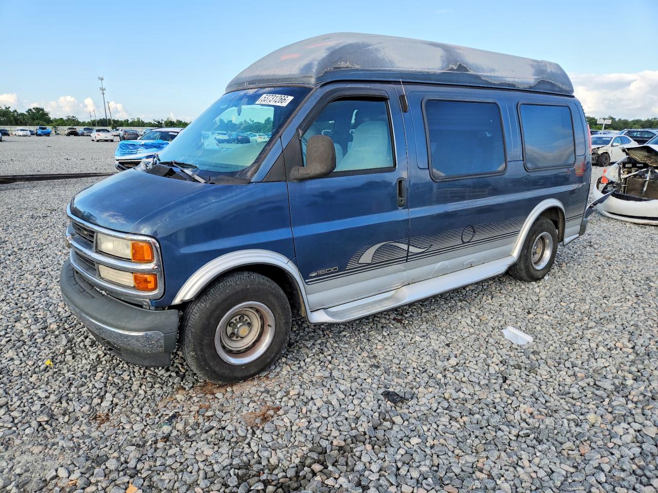 1999 Chevrolet Express, VIN 1GBFG15R4X1036737 — Side