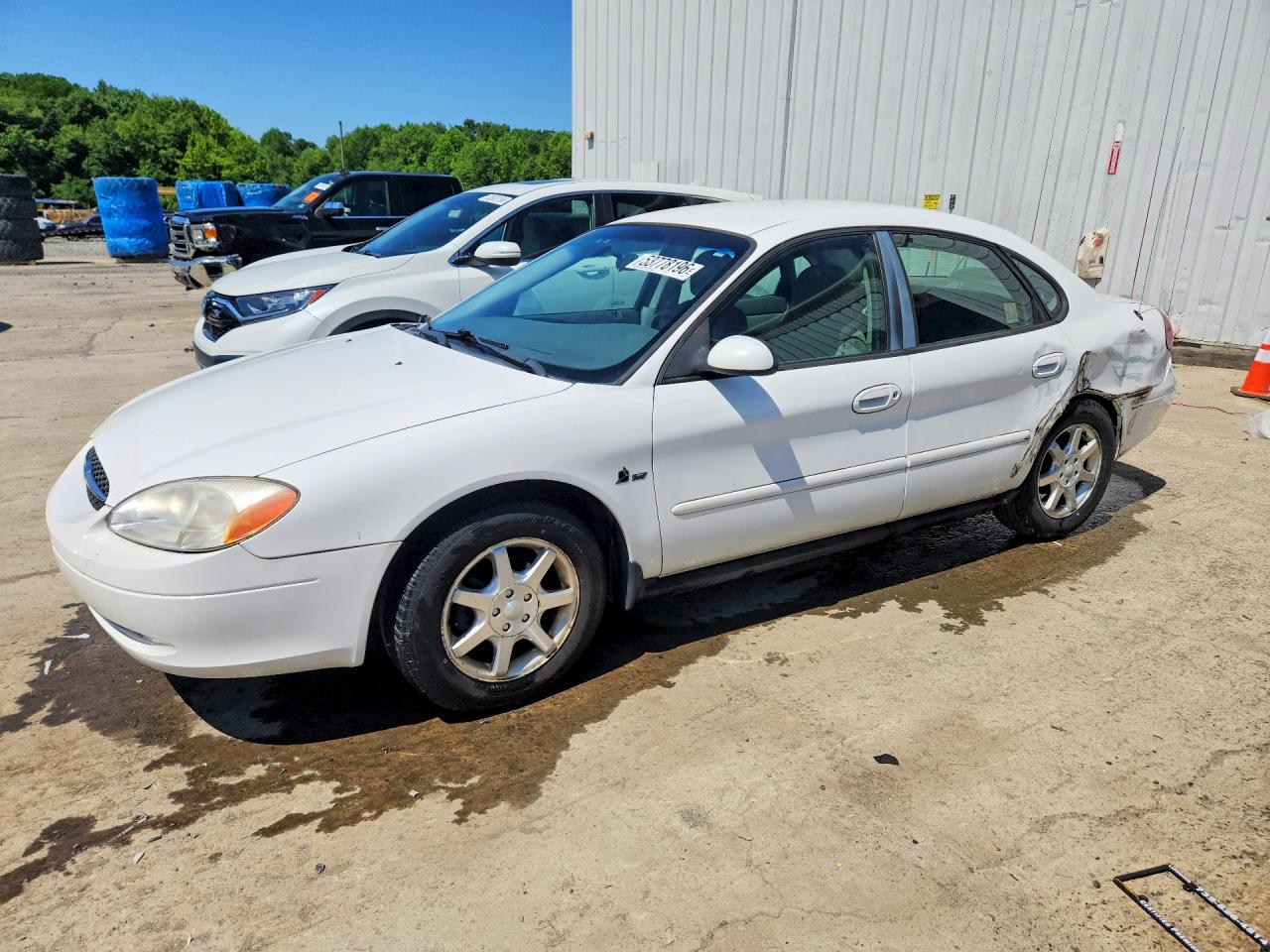 2000 Ford Taurus SES, VIN 1FAFP5528YG140741 — Бок