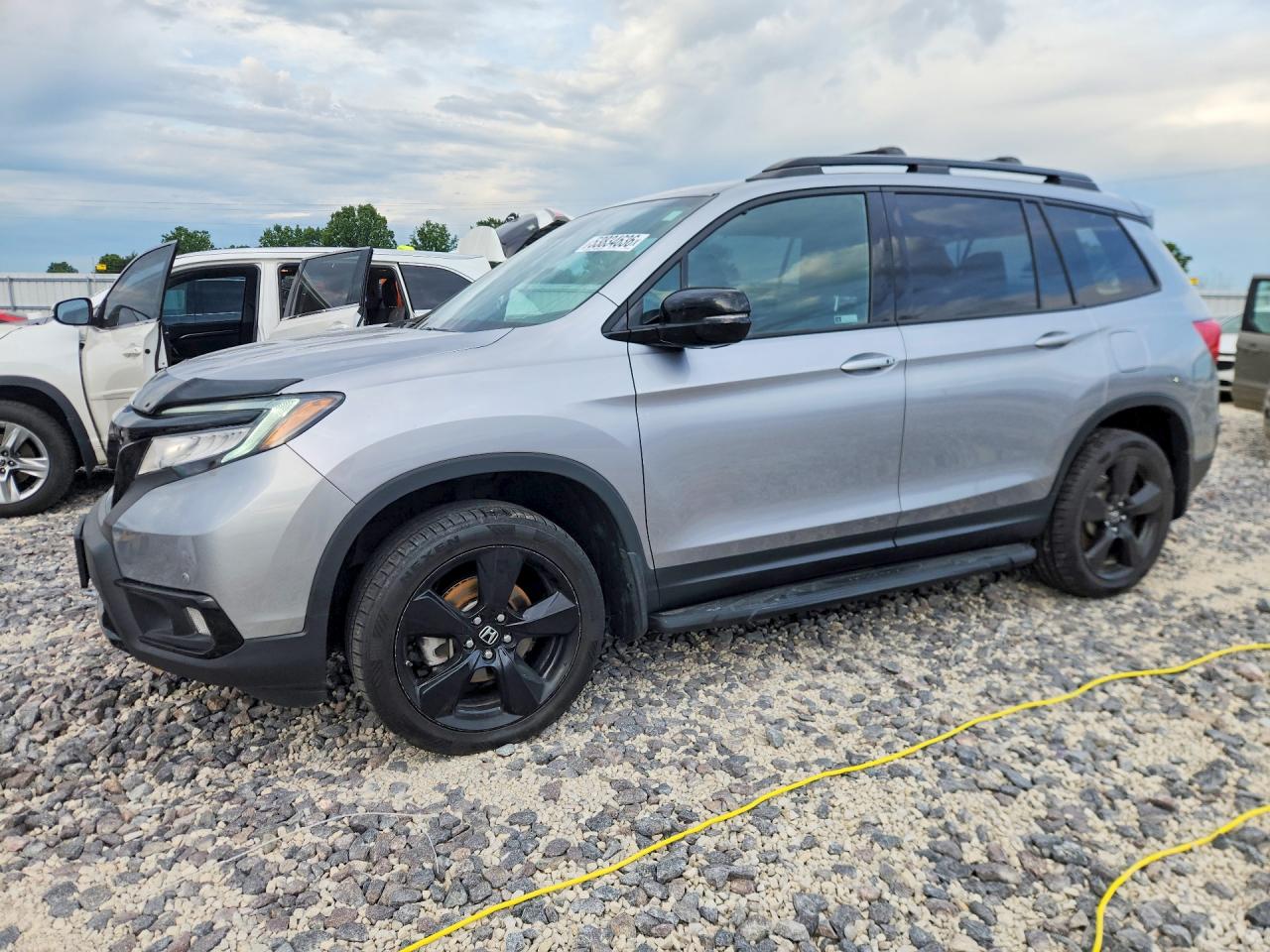 2020 Honda Passport Elite, VIN 5FNYF8H02LB006621 — Hail