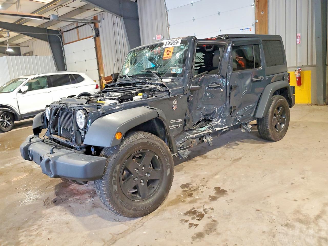 2017 Jeep Wrangler Unlimited Willys Wheeler, VIN 1C4HJWDG7HL556780 — Side