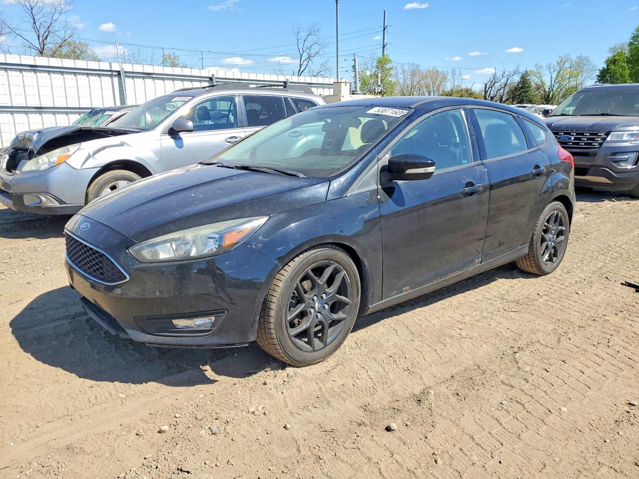 2016 Ford Focus SE, VIN 1FADP3K24GL296393 — Side