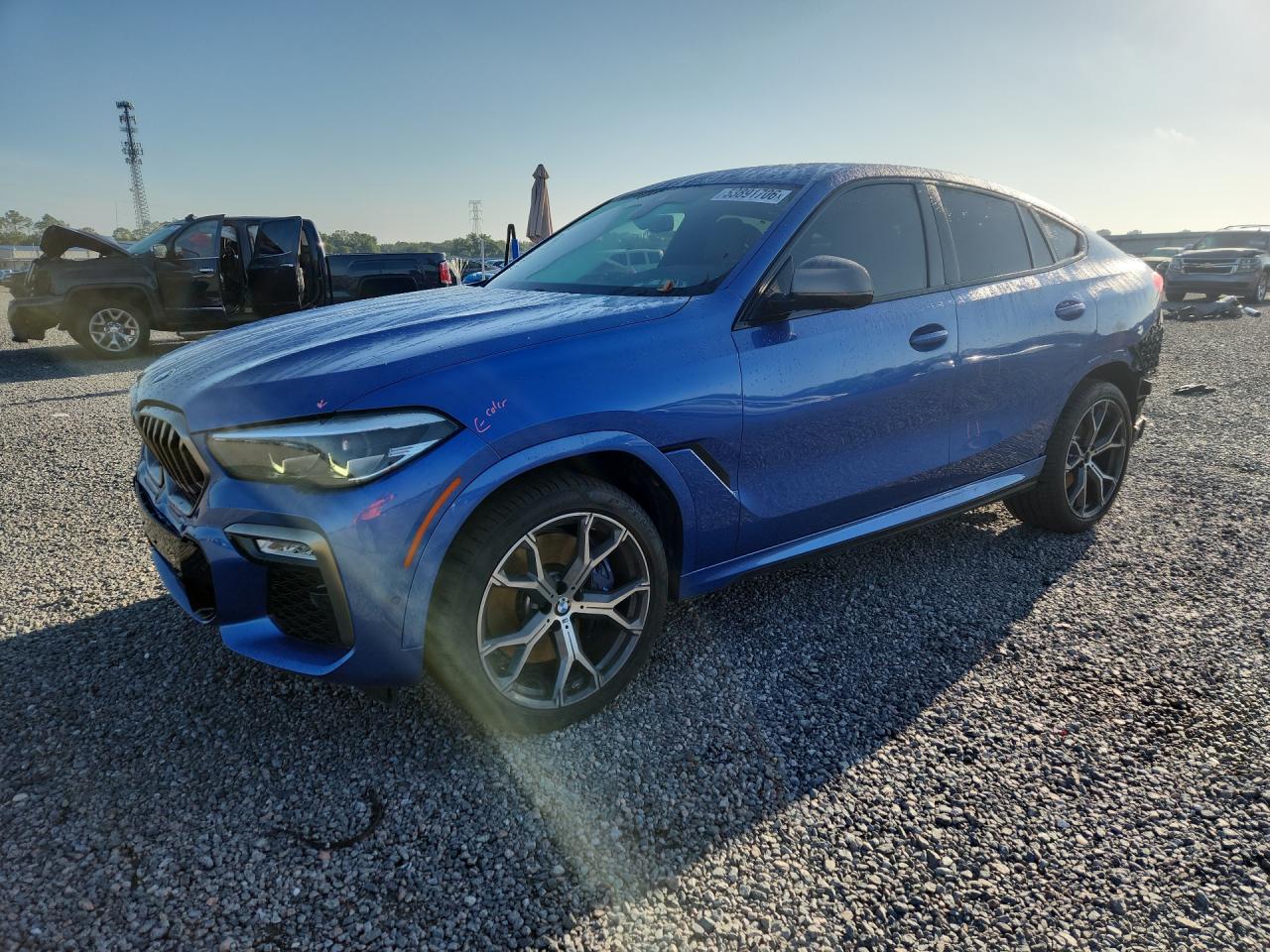 2020 BMW X6 M50i, VIN 5UXCY8C02LLE40418 — Зад