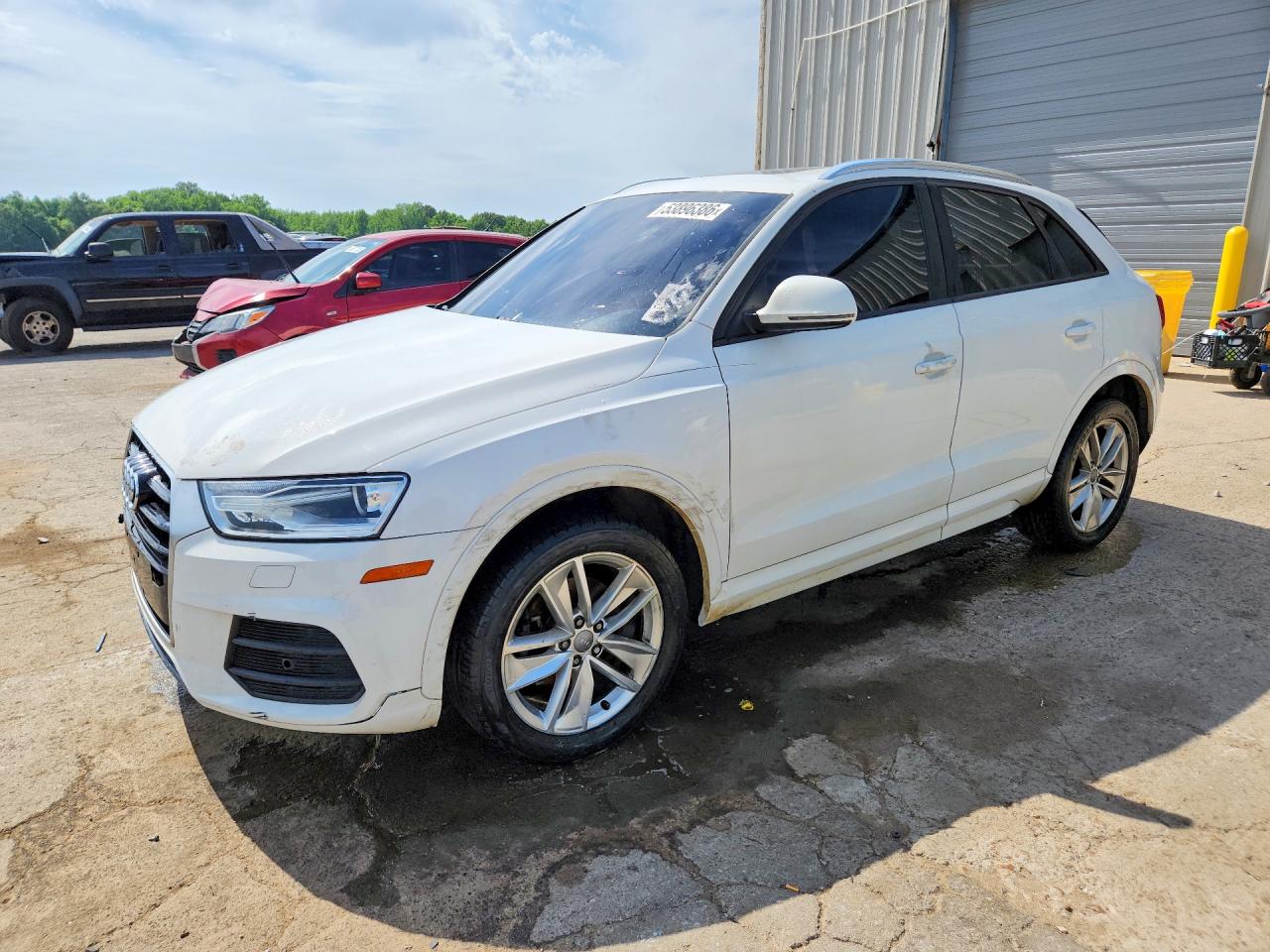 2017 Audi Q3 Premium, VIN WA1BCCFS6HR010883 — Side
