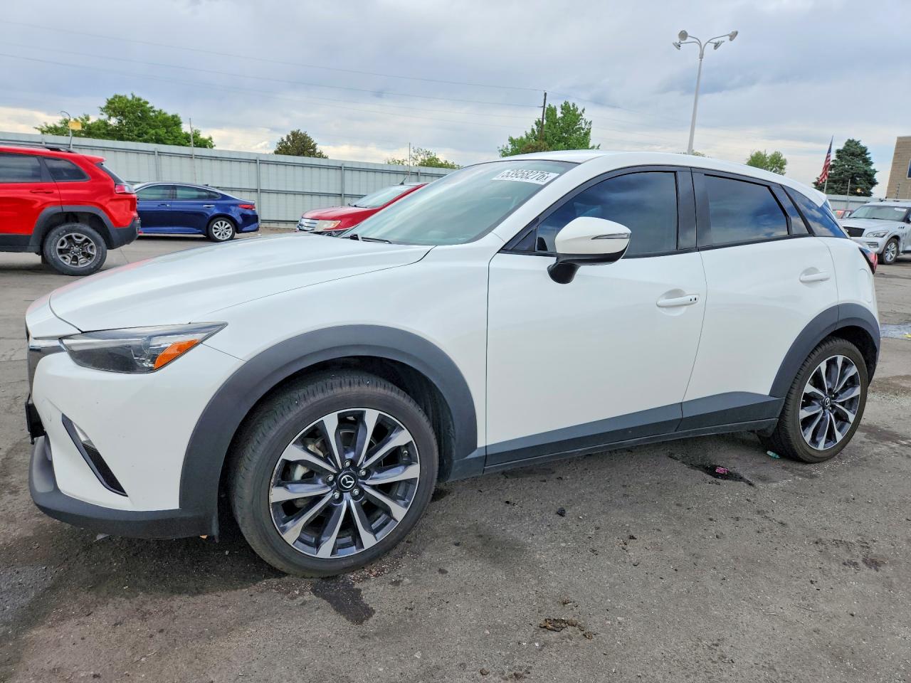 2019 Mazda CX-3 Touring, VIN JM1DKFC7XK0444111 — Side