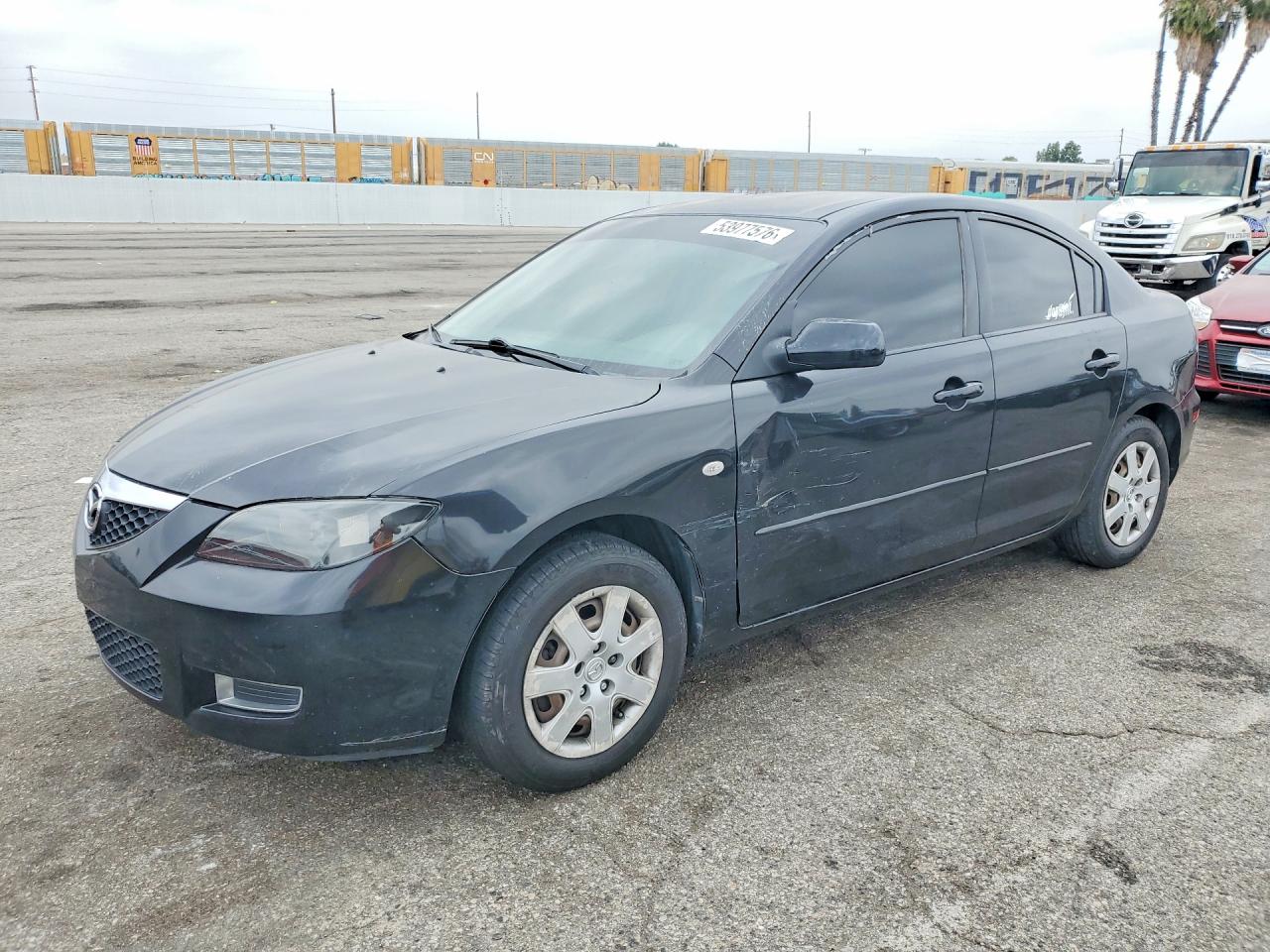 2009 Mazda 3 i Touring Value, VIN JM1BK32G091247850 — Бок