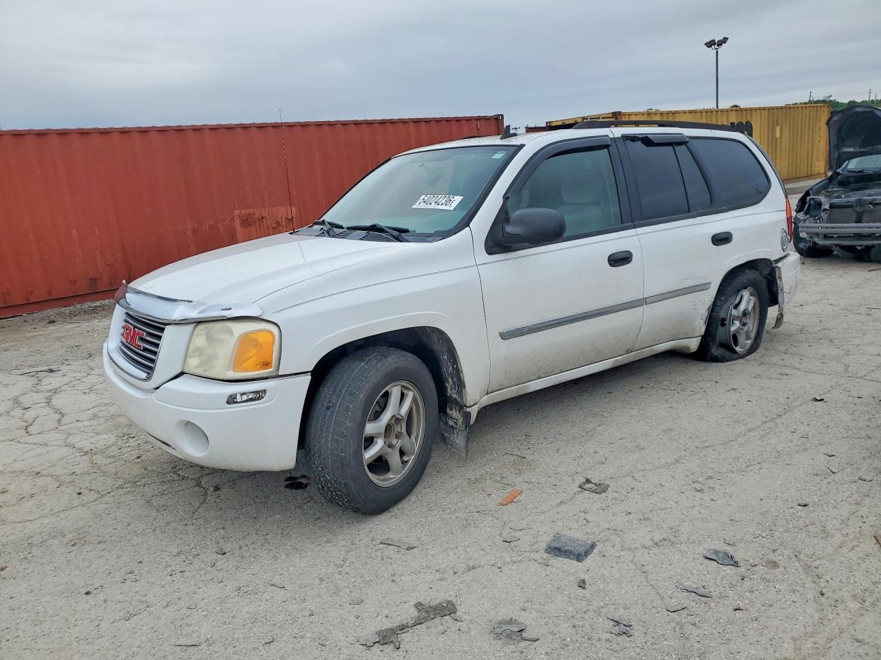 2007 GMC Envoy SLE, VIN 1GKDS13S472227290 — Зад