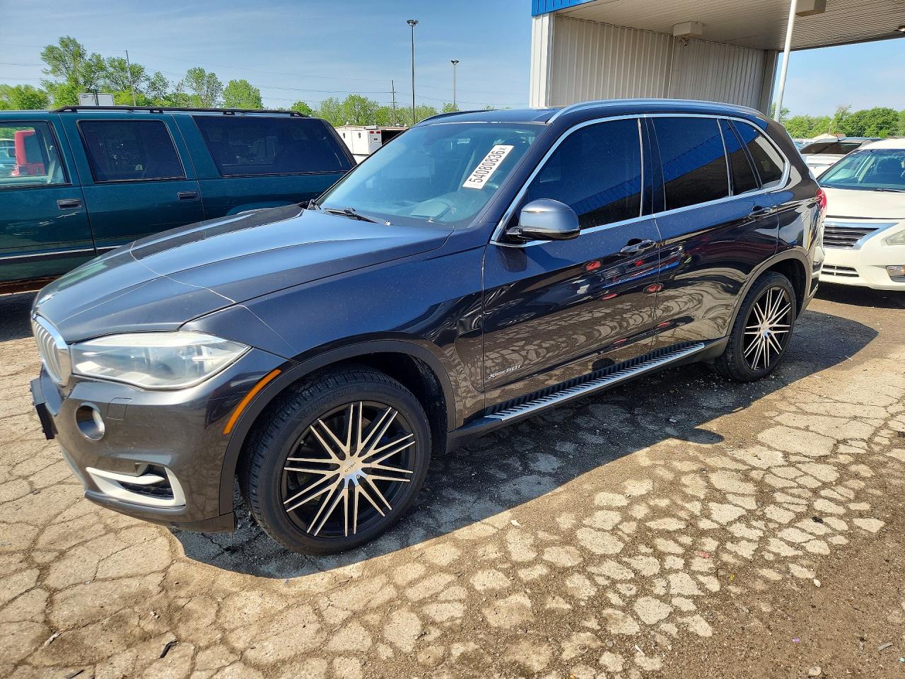 2015 BMW X5 xDrive50i, VIN 5UXKR6C51F0J77611 — Minor dents and scratches