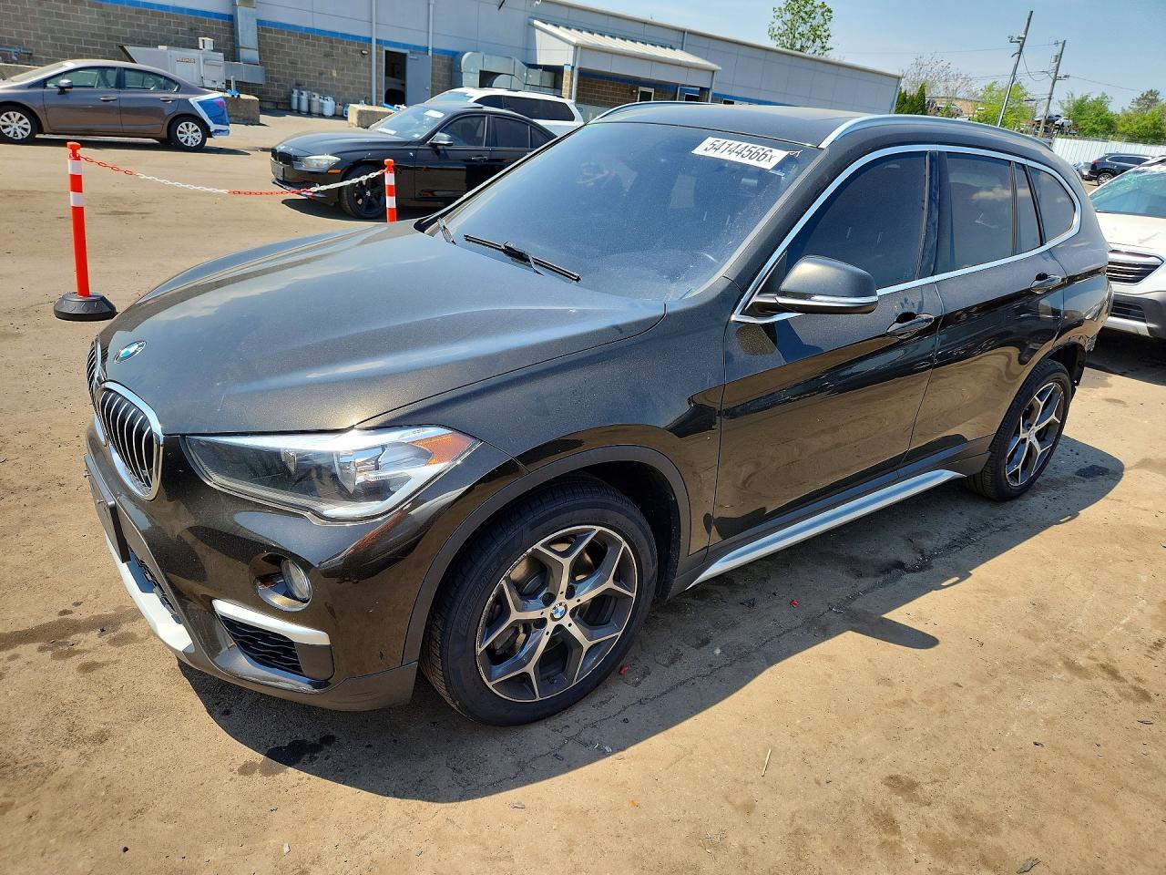 2018 BMW X1 xDrive28i, VIN WBXHT3C34J5L27008 — Rear end