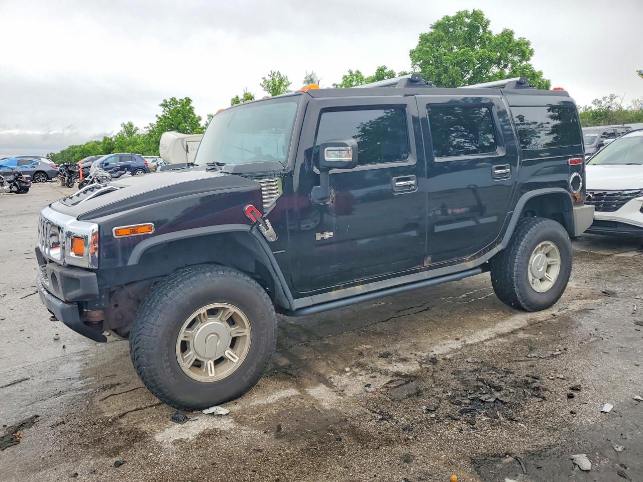 2004 Hummer H2, VIN 5GRGN23U24H112847 — Бок