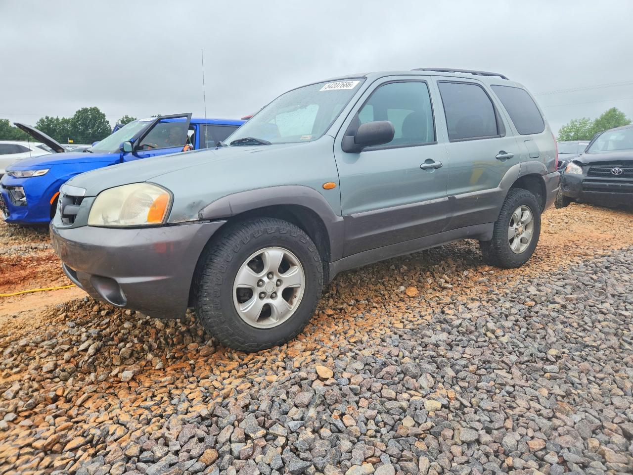 2004 Mazda Tribute LX, VIN 4F2CZ94124KM19200 — Hail