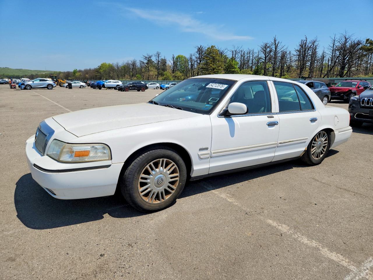 2010 Mercury Grand Marquis LS, VIN 2MEBM7FV9AX639245 — Minor dents and scratches