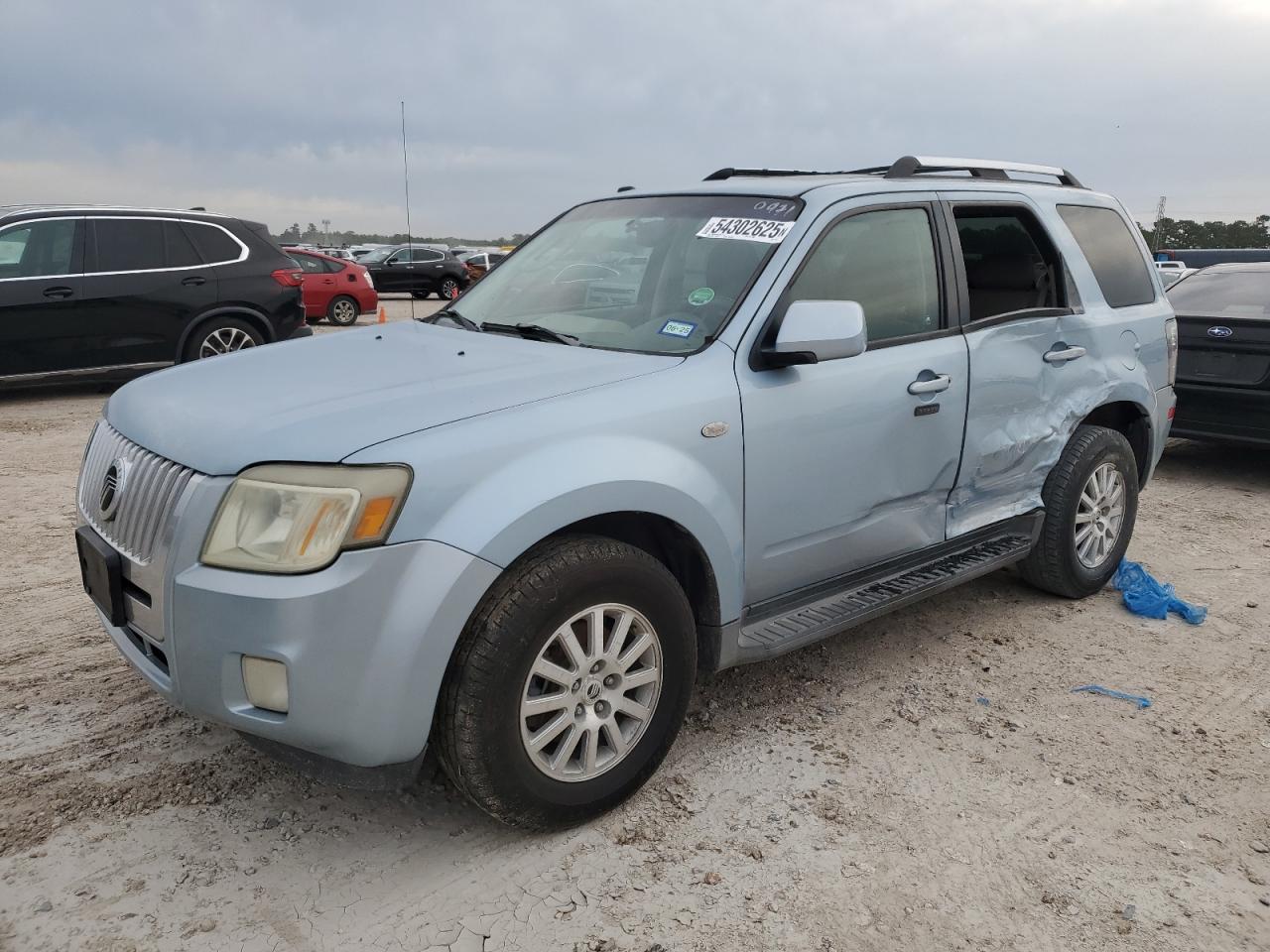 2009 Mercury Mariner Premier, VIN 4M2CU87G69KJ10971 — Side