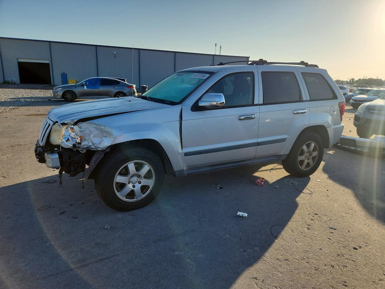 2009 Jeep Grand Cherokee Laredo, VIN 1J8GR48K99C521417 — Front end