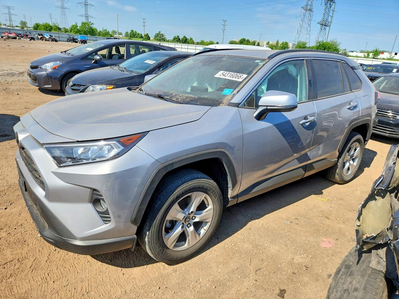 2020 Toyota RAV4 XLE, VIN 2T3P1RFV1LW111692 — Side