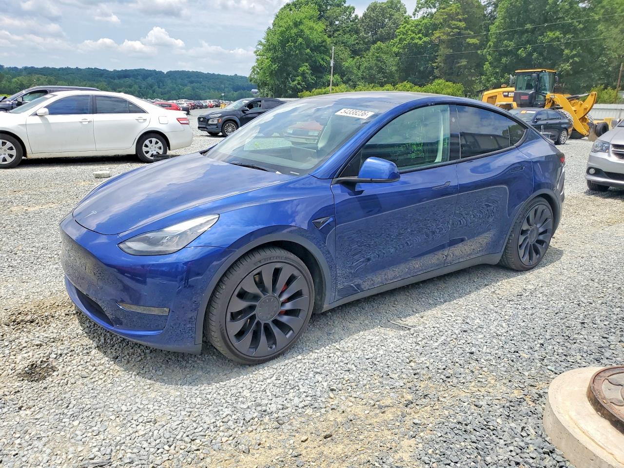 2024 Tesla Model Y Performance, VIN 7SAYGDEF2RA265200 — Side