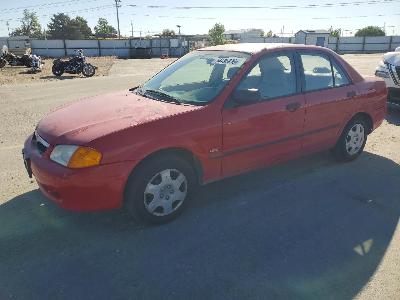 2000 Mazda Protege DX, VIN JM1BJ2229Y0296079 — Side
