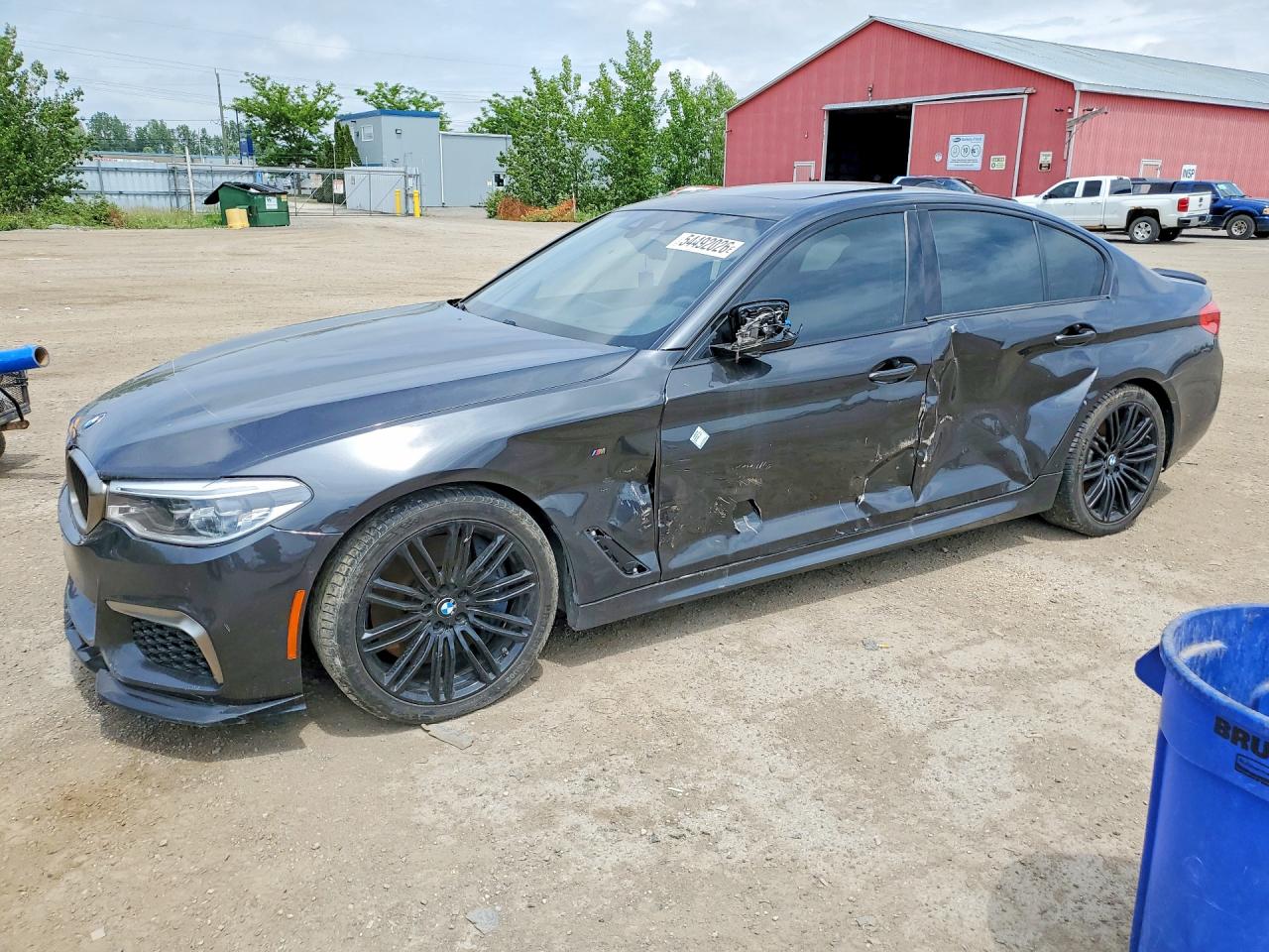2018 BMW 5 Series M550i xDrive, VIN WBAJB9C54JG464036 — Side