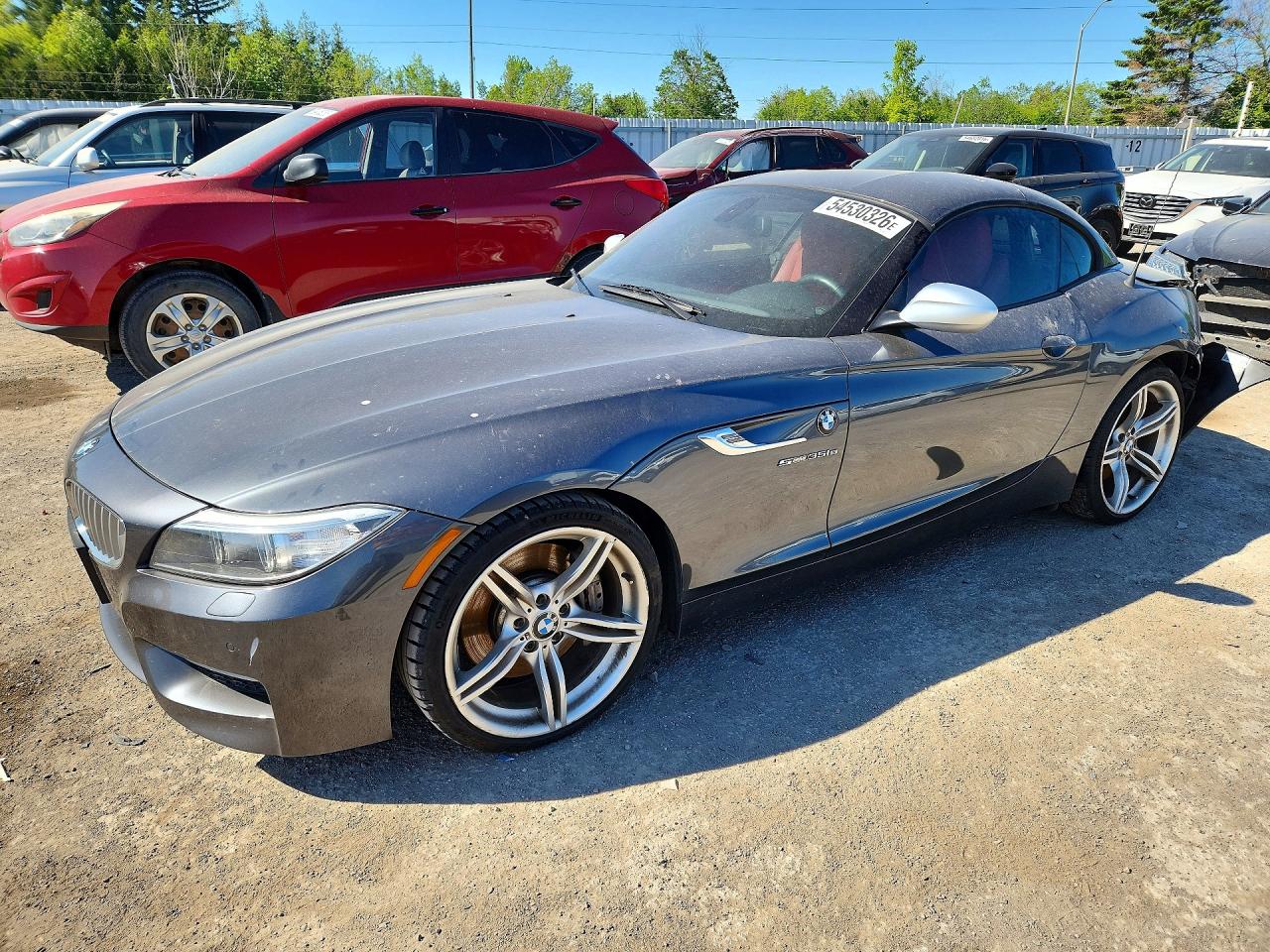 2016 BMW Z4 sDrive35is, VIN WBALM1C52GE634841 — Зад